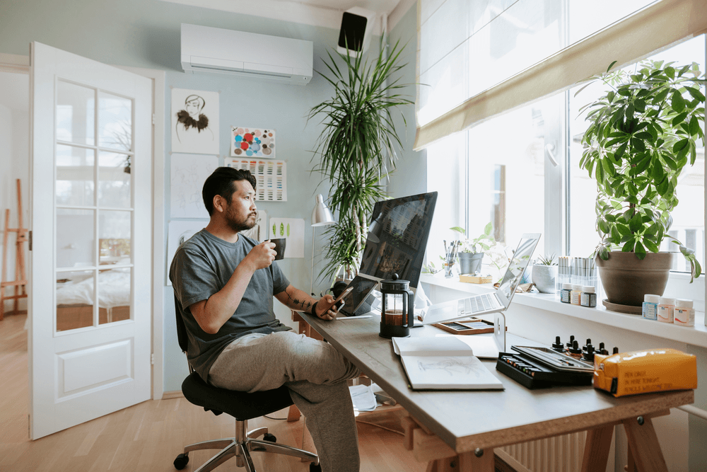 Mitsubishi mini split installed in home office above desk workspace
